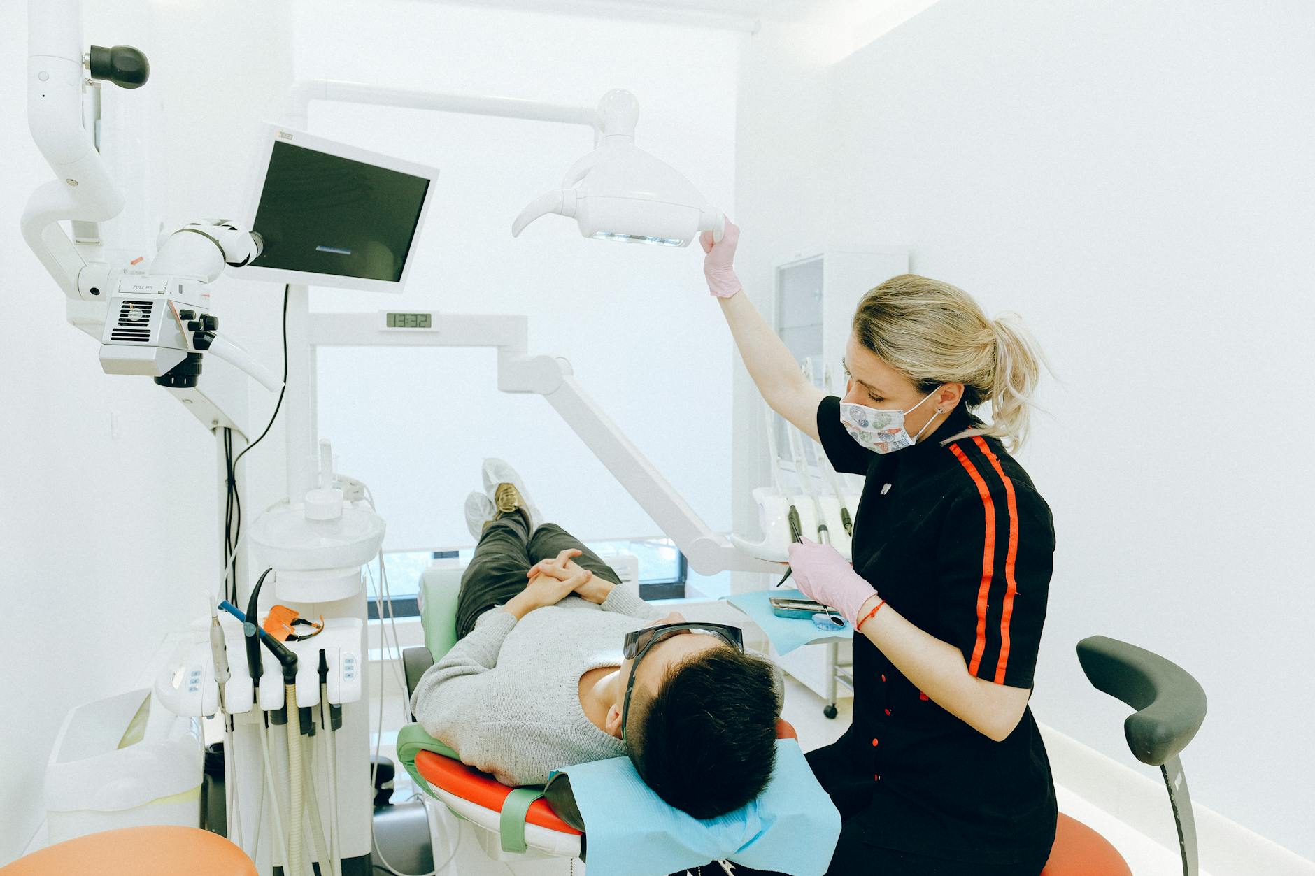 Photograph of a dentist working with a patient. 
